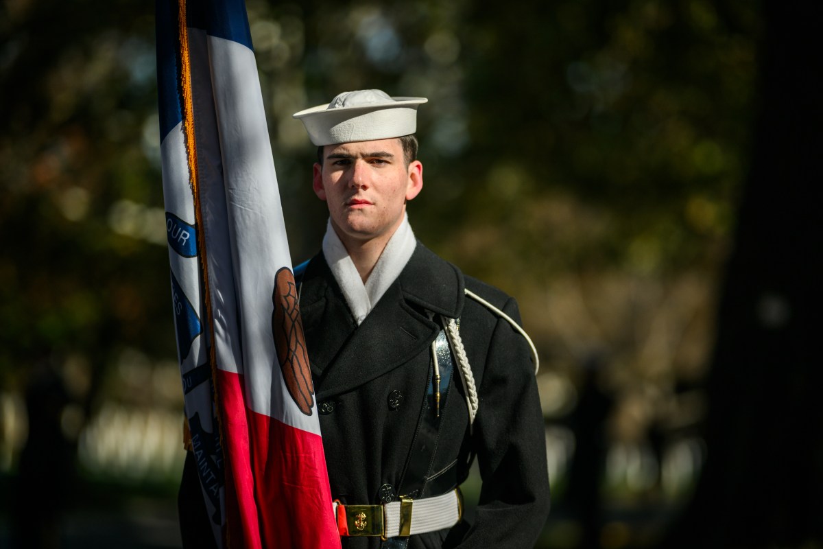 A member of the military stands at attention as President Donald Trump arrives for a wreath-laying ceremony at the Tomb of the Unknown Soldier in observance of Veterans Day, Tuesday, November 11, 2025, at Arlington National Cemetery in Arlington, Virginia. (Official White House Photo by Daniel Torok)