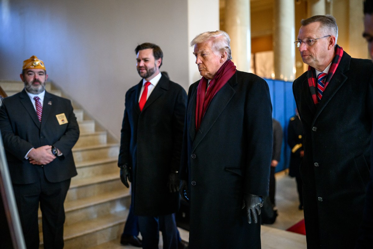 President Donald Trump, Vice President JD Vance, and Secretary of Veterans Affairs Doug Collins walk towards the stage during Veterans Day ceremonies at Arlington National Cemetery in Arlington, Virginia, Tuesday, November 11, 2025. (Official White House Photo by Daniel Torok)