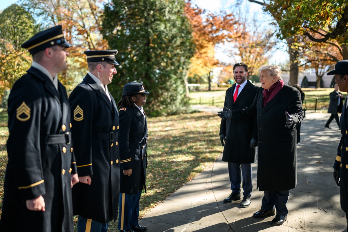President Donald Trump and Vice President JD Vance speak with members of the military as they depart a Veterans Day ceremony at the Memorial Amphitheater at Arlington National Cemetery, Tuesday, November 11, 2025, in Arlington, Virginia. (Official White House Photo by Daniel Torok)