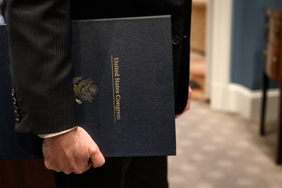 White House Staff Secretary Will Scharf holds the funding bill from Congress that President Donald Trump will sign in the Oval Office, officially reopening the government, Wednesday, November 12, 2025. (Official White House Photo by Joyce N. Boghosian)