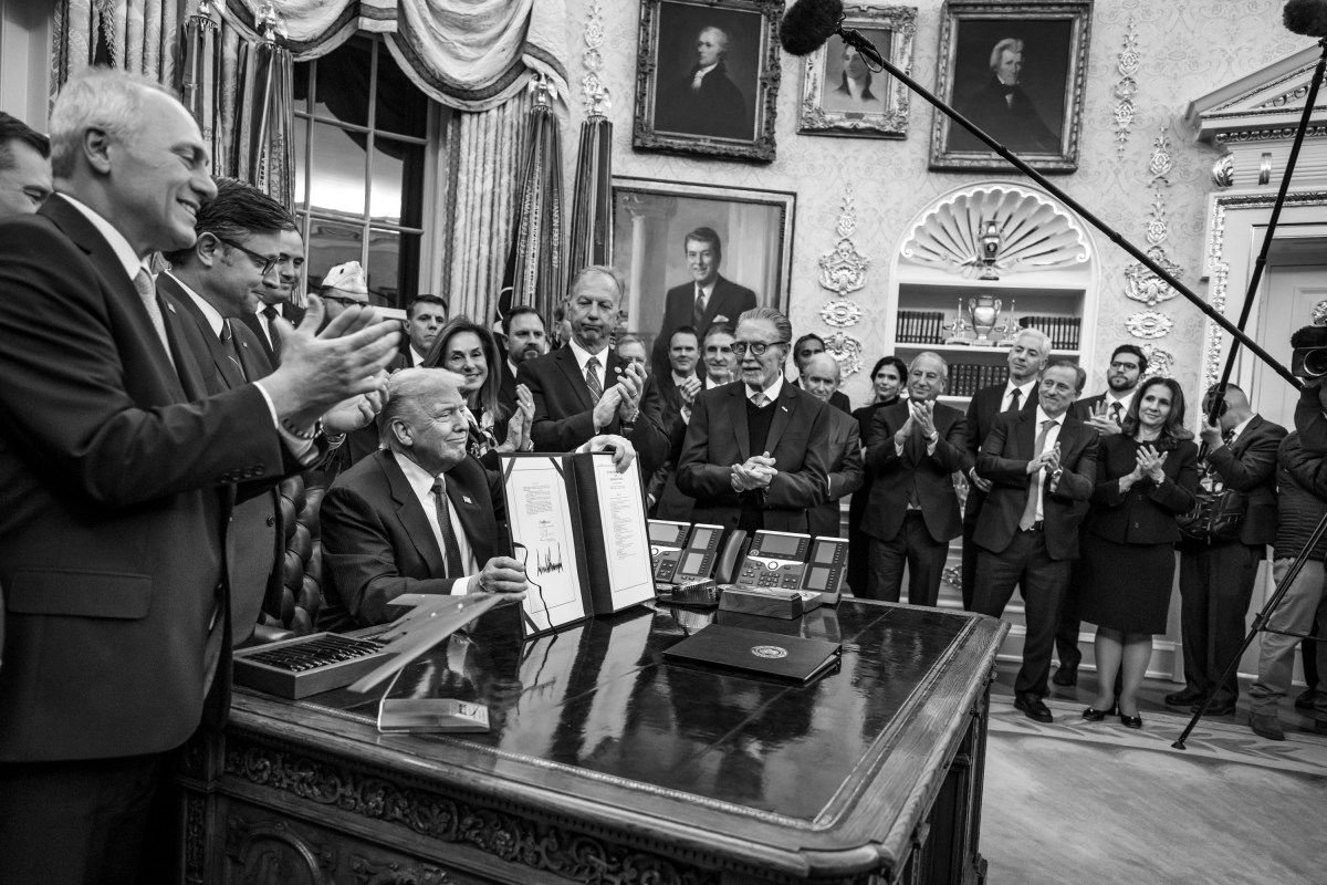 President Donald Trump shows members of the media the signed funding bill from Congress that reopens the government, Wednesday, November 12, 2025, in the Oval Office. (Official White House Photo by Joyce N. Boghosian)