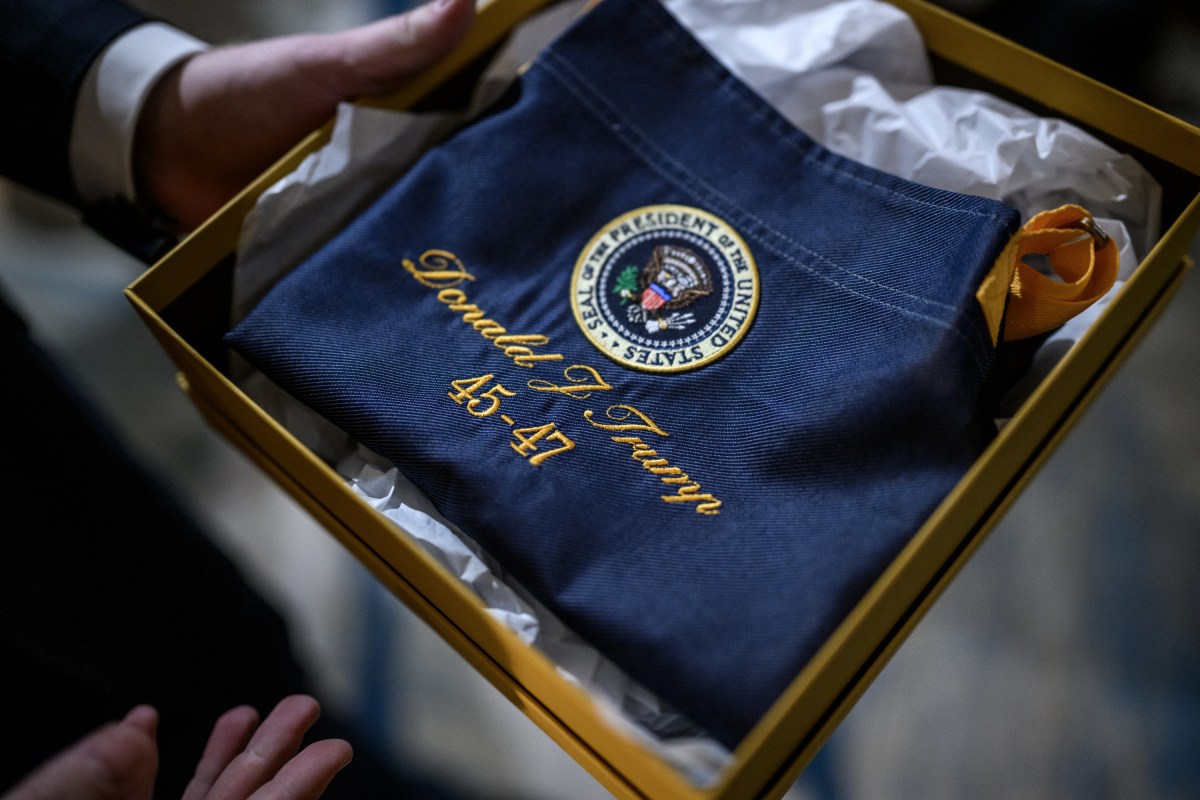 President Donald Trump is presented with a gift after his arrival at the Westin D.C. in Washington, D.C. to address the McDonald’s Impact Summit, Monday, November 17, 2025. (Official White House Photo by Daniel Torok)