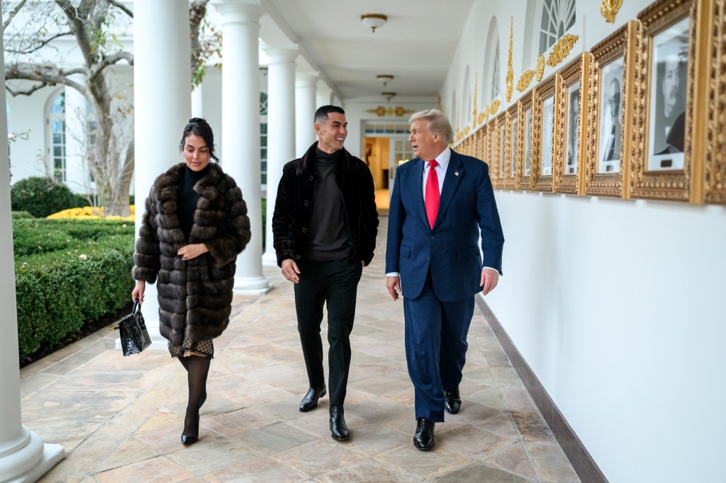 President Donald Trump walks with Cristiano Ronaldo and Georgina Rodríguez on the West Colonnade of the White House, Tuesday, November 18, 2025. (Official White House Photo by Daniel Torok)