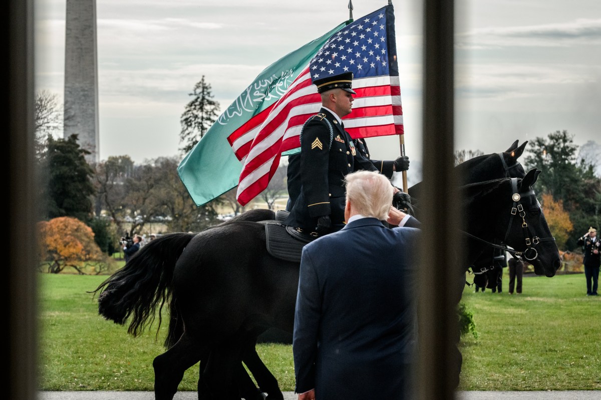 Soldiers on horseback pass President Donald Trump during a welcome ceremony for Crown Prince and Prime Minister Mohammed bin Salman Al Saud of Saudi Arabia at the South Portico of the White House, Tuesday, November 18, 2025. (Official White House Photo by Joyce N. Boghosian)