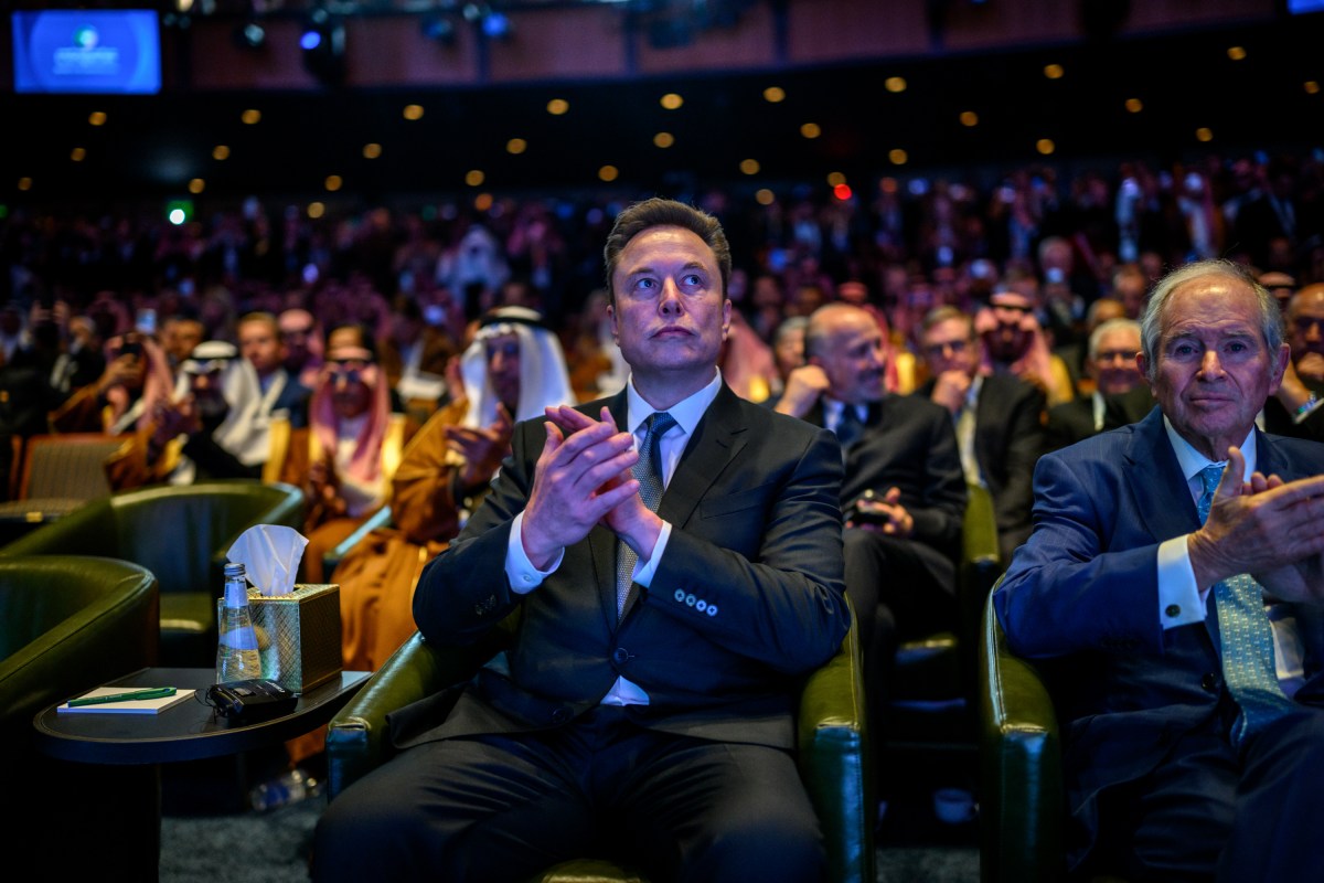 Elon Musk listens to President Donald Trump deliver remarks at the U.S.-Saudi Investment Forum, Wednesday, November 19, 2025, at the John F. Kennedy Center for the Performing Arts in Washington, D.C. (Official White House Photo by Daniel Torok)