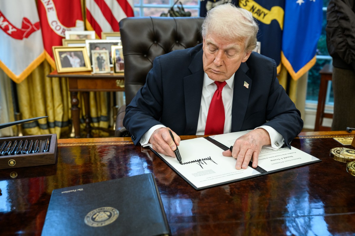 President Donald Trump signs the pardon for the national Thanksgiving turkeys, Tuesday, November 25, 2025, in the Oval Office. (Official White House Photo by Daniel Torok)