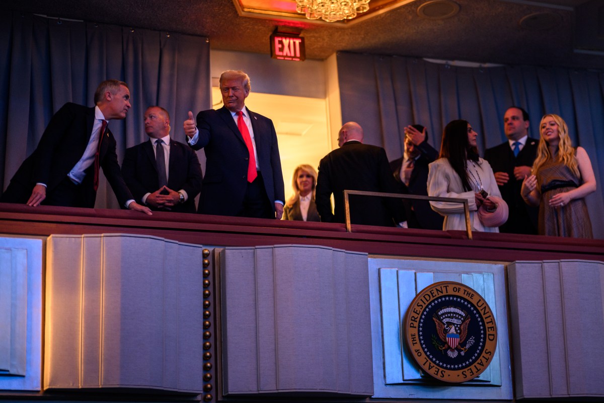 President Donald Trump gestures to the crowd from his seat at the FIFA World Cup drawing, Friday, December 5, 2025, at the John F. Kennedy Center for the Performing Arts in Washington, D.C. (Official White House Photo by Daniel Torok)