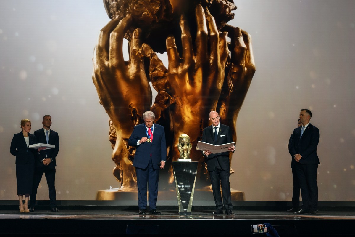 President Donald Trump accepts the inaugural FIFA Peace Prize from FIFA President Gianni Infantino, Friday, December 5, 2025, during the FIFA World Cup drawing at the John F. Kennedy Center for the Performing Arts in Washington, D.C. (Official White House Photo by Daniel Torok)