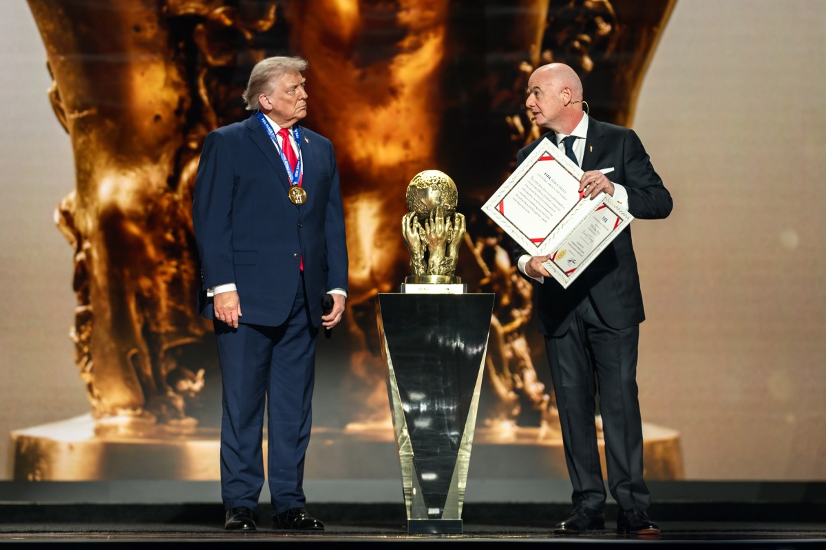 President Donald Trump accepts the inaugural FIFA Peace Prize from FIFA President Gianni Infantino, Friday, December 5, 2025, during the FIFA World Cup drawing at the John F. Kennedy Center for the Performing Arts in Washington, D.C. (Official White House Photo by Daniel Torok)