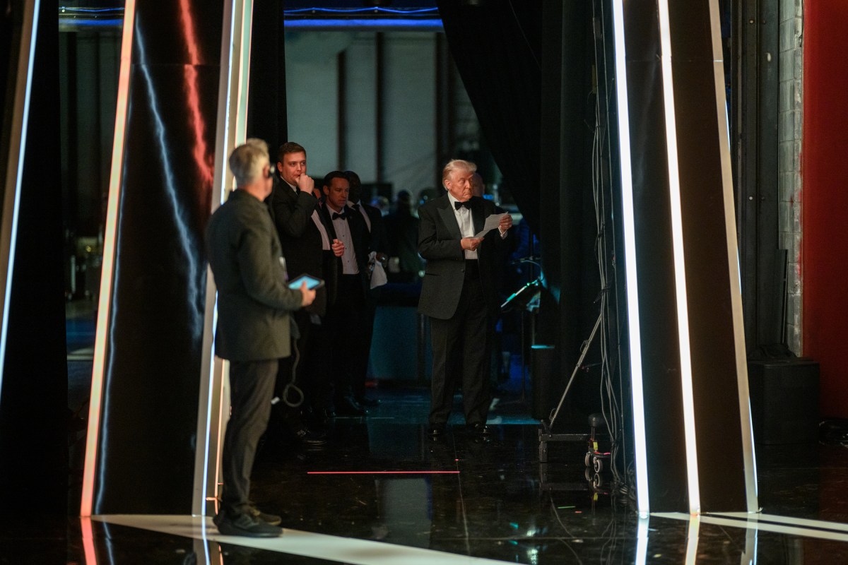 President Donald Trump reviews his speech before delivering remarks at the Kennedy Center Honors celebrating Sylvester Stallone, Gloria Gaynor, George Strait, members of KISS, and Michael Crawford at the Kennedy Center in Washington, D.C., Sunday, December 7, 2025. (Official White House Photo by Daniel Torok)