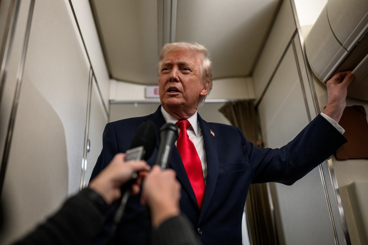 President Donald Trump answers questions from members of the media aboard Air Force One en route to Mount Pocono, Pennsylvania, for a rally on the economy, Tuesday, December 9, 2025. (Official White House Photo by Molly Riley)
