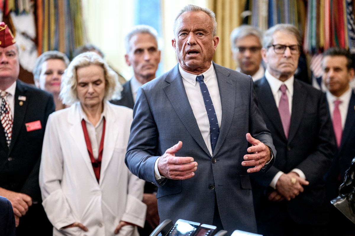 President Donald Trump signs an executive order reclassifying marijuana as a Schedule III substance with looser restrictions in the Oval Office, Thursday, December 18, 2025. (Official White House Photo by Molly Riley)