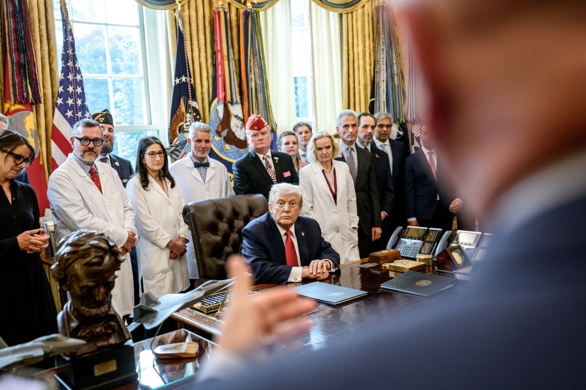 President Donald Trump signs an executive order reclassifying marijuana as a Schedule III substance with looser restrictions in the Oval Office, Thursday, December 18, 2025. (Official White House Photo by Molly Riley)