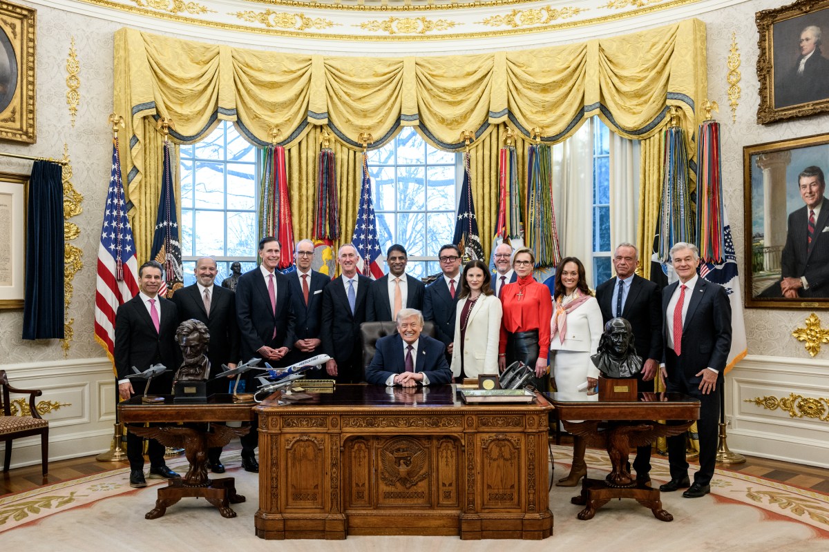 President Donald Trump poses for photos in the Oval Office after making an announcement on prescription drug prices, Friday, December 19, 2025. (Official White House Photo by Joyce N. Boghosian)