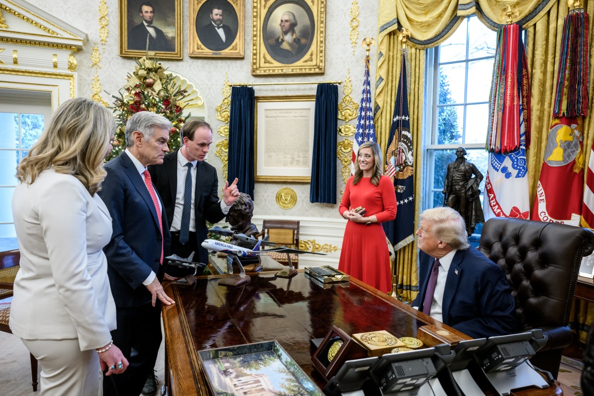 President Donald Trump poses for photos in the Oval Office after making an announcement on prescription drug prices, Friday, December 19, 2025. (Official White House Photo by Joyce N. Boghosian)