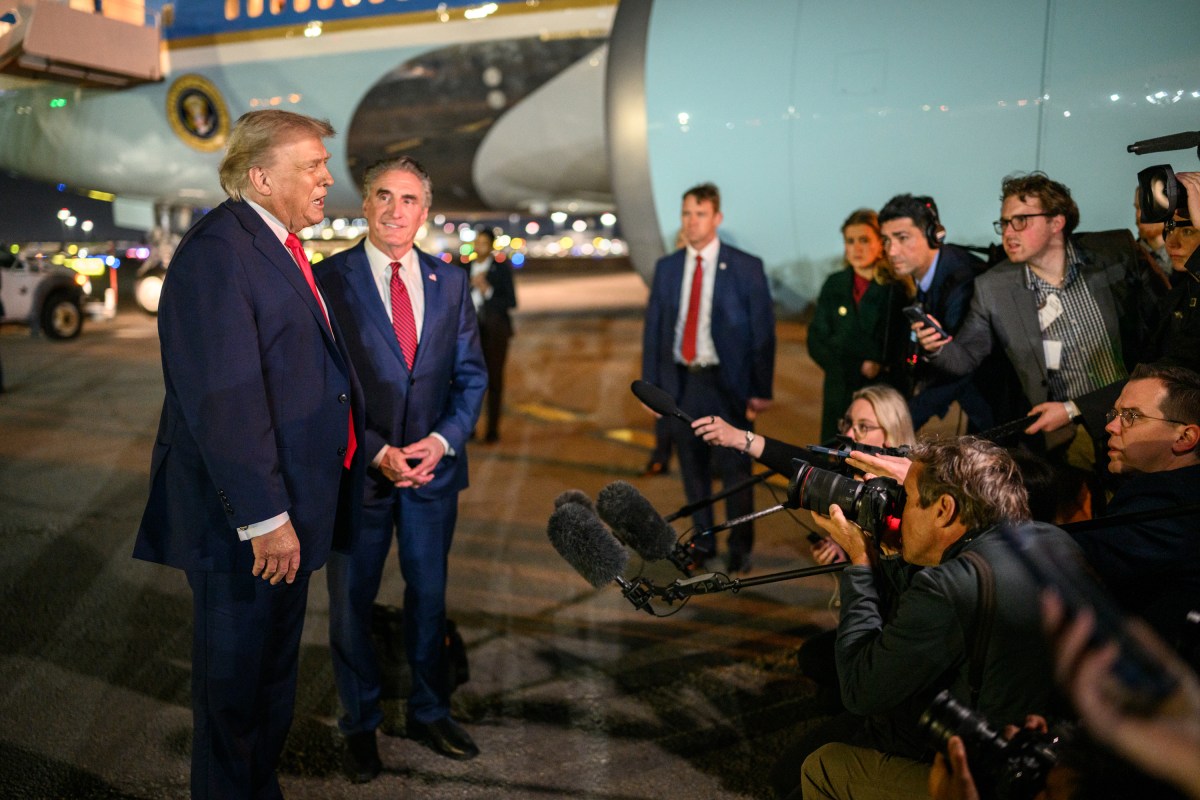 President Donald Trump speaks to press before boarding Air Force One at Miami International Airport in Miami, Florida on Monday, January 19, 2026, en route to Joint Base Andrews, Maryland. (Official White House Photo by Daniel Torok)