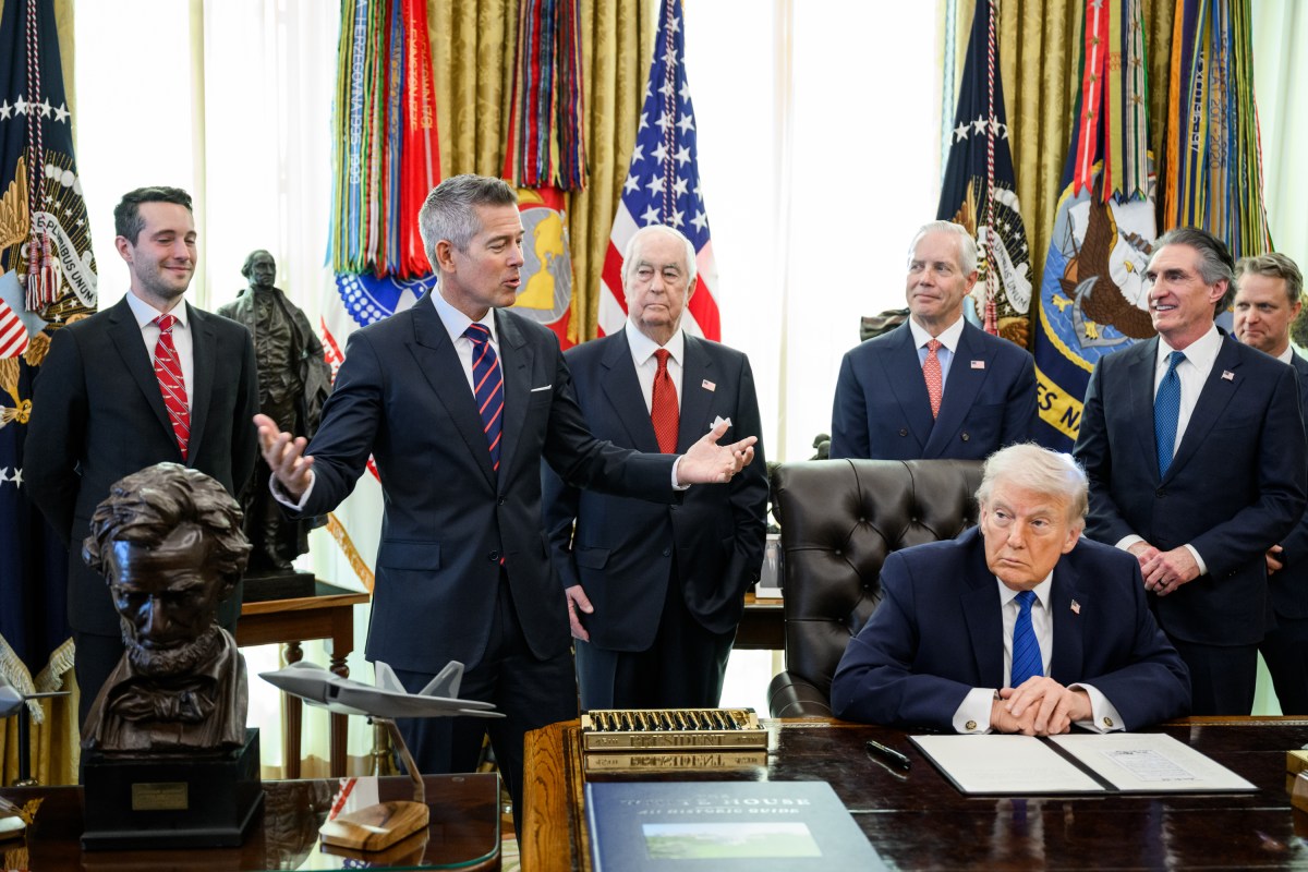 President Donald Trump signs an executive order bringing IndyCar racing to Washington, D.C., Friday, January 30, 2026, in the Oval Office. President Trump is joined by Secretary of Transportation Sean Duffy, Secretary of Interior Doug Burgum, Penske Corporation Chair Roger Penske, and Penske Corporation President Bud Denker. (Official White House Photo by Molly Riley)