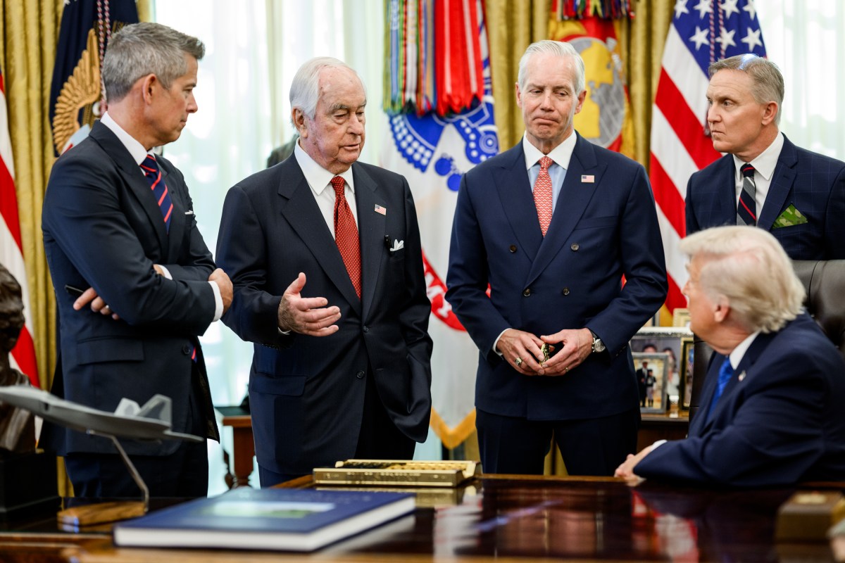President Donald Trump signs an executive order bringing IndyCar racing to Washington, D.C., Friday, January 30, 2026, in the Oval Office. President Trump is joined by Secretary of Transportation Sean Duffy, Secretary of Interior Doug Burgum, Penske Corporation Chair Roger Penske, and Penske Corporation President Bud Denker. (Official White House Photo by Molly Riley)