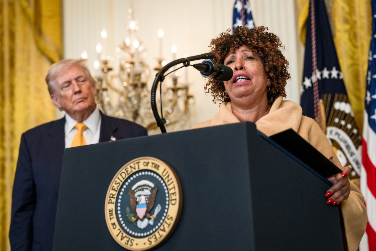 President Donald Trump looks on as Felicia Cook delivers remarks at a Black History Month reception, Wednesday, February 18, 2026, in the East Room of the White House. (Official White House Photo by Joyce N. Boghosian)