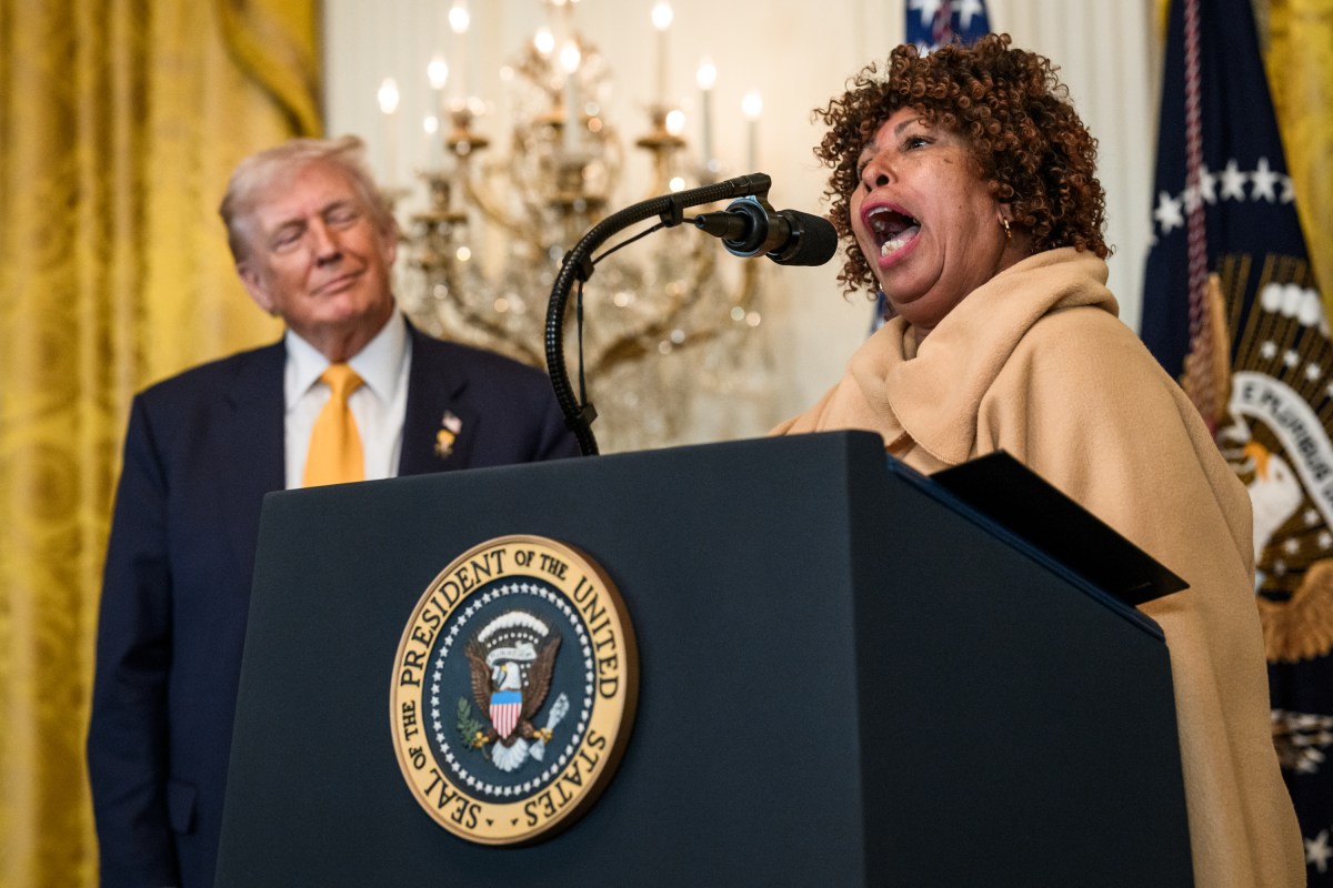 President Donald Trump looks on as Felicia Cook delivers remarks at a Black History Month reception, Wednesday, February 18, 2026, in the East Room of the White House. (Official White House Photo by Joyce N. Boghosian)