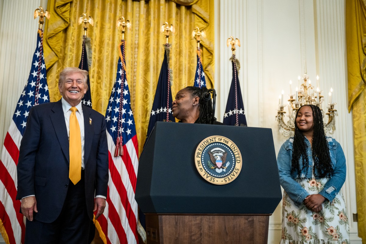 President Donald Trump looks on as Greta Alexander delivers remarks at a Black History Month reception, Wednesday, February 18, 2026, in the East Room of the White House. (Official White House Photo by Joyce N. Boghosian)