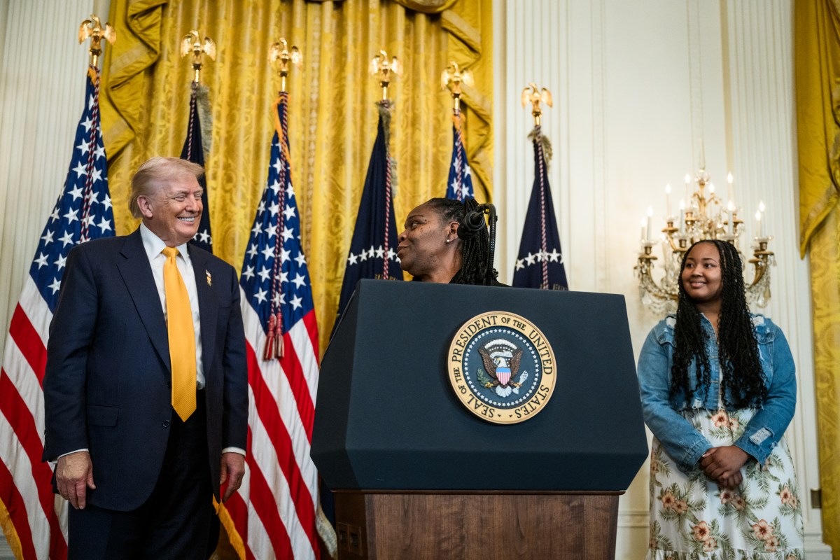 President Donald Trump looks on as Greta Alexander delivers remarks at a Black History Month reception, Wednesday, February 18, 2026, in the East Room of the White House. (Official White House Photo by Joyce N. Boghosian)