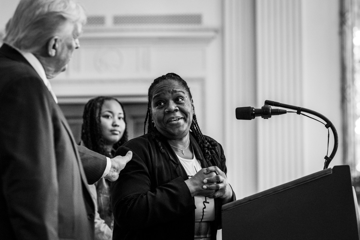 President Donald Trump looks on as Greta Alexander delivers remarks alongside her daughter at a Black History Month reception, Wednesday, February 18, 2026, in the East Room of the White House. (Official White House Photo by Joyce N. Boghosian)