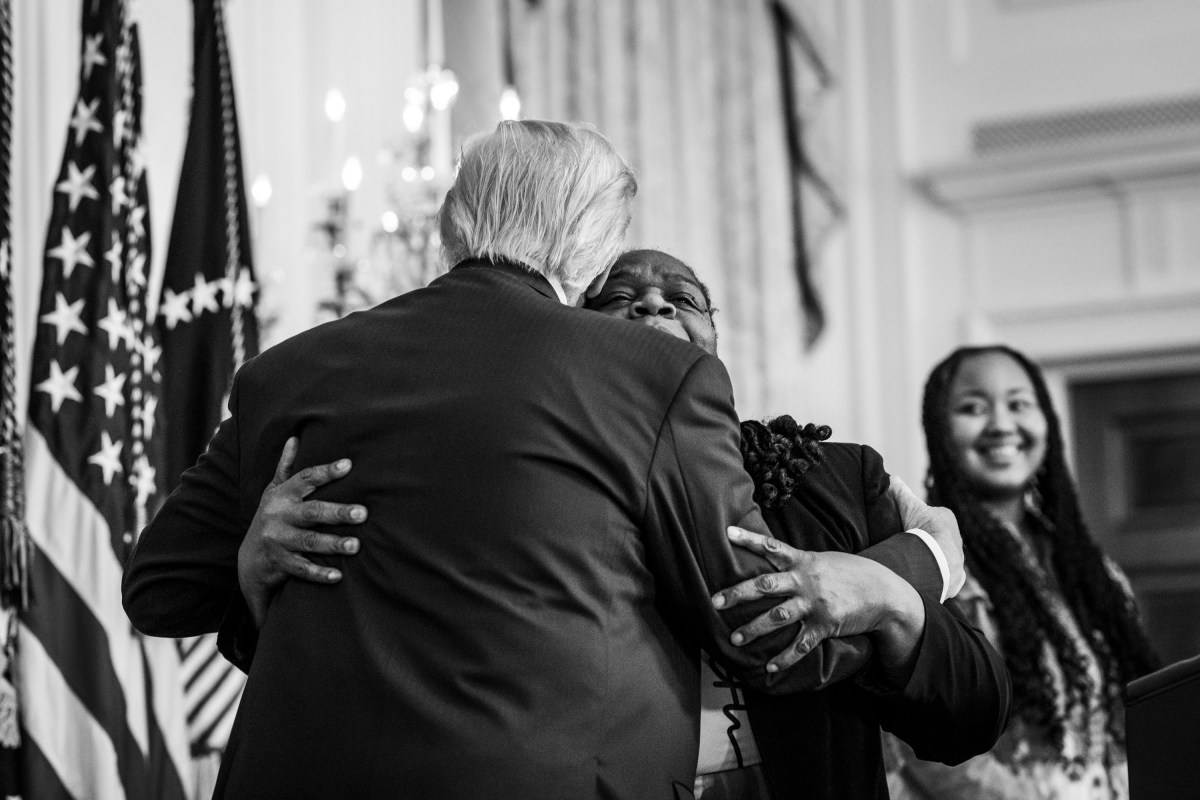 President Donald Trump hugs Greta Alexander after she delivered remarks at a Black History Month reception, Wednesday, February 18, 2026, in the East Room of the White House. (Official White House Photo by Joyce N. Boghosian)