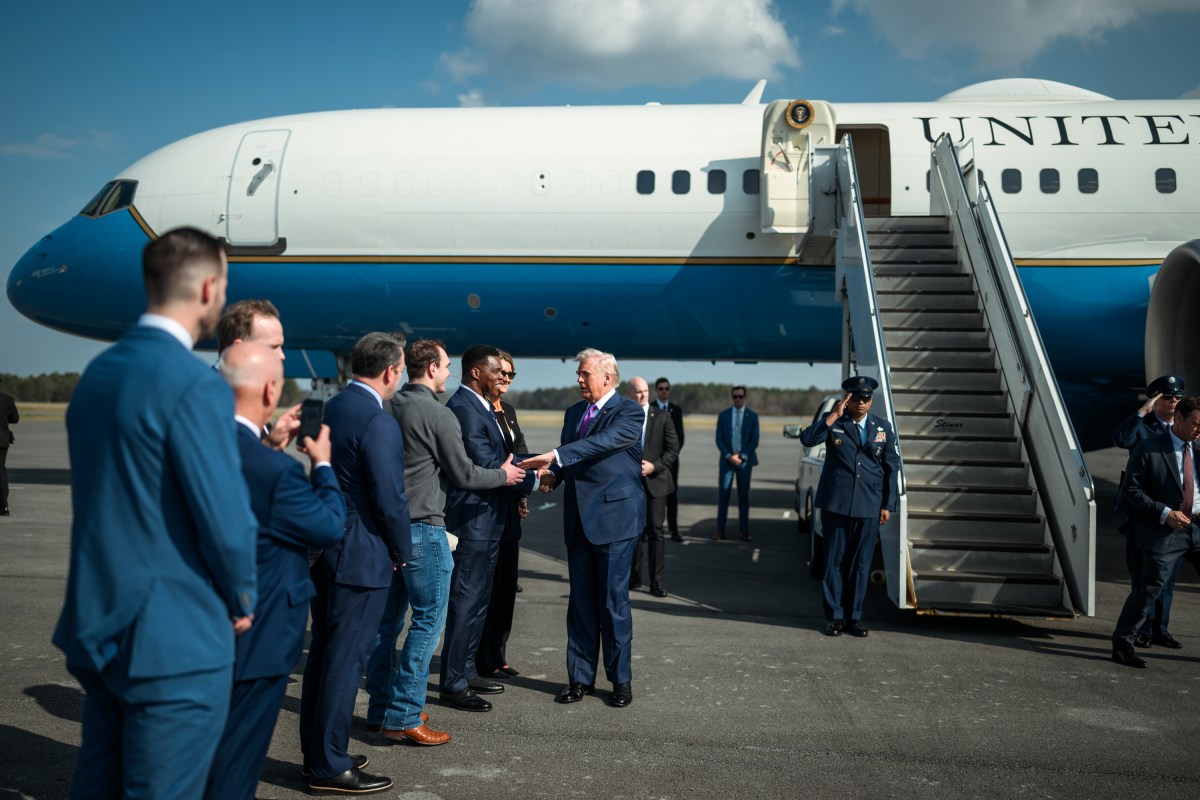 President Donald Trump greets SBA Administrator Kelly Loeffler, Lt. Gov. Burt Jones, Ambassador Herschel Walker, Rep. Brian Jack (R-GA), congressional candidate Clay Fuller and Georgia Bulldogs quarterback Gunner Stockton  at Richard B. Russell Regional Airport in Rome, Georgia, Thursday, February 19, 2026. (Official White House Photo by Daniel Torok)
