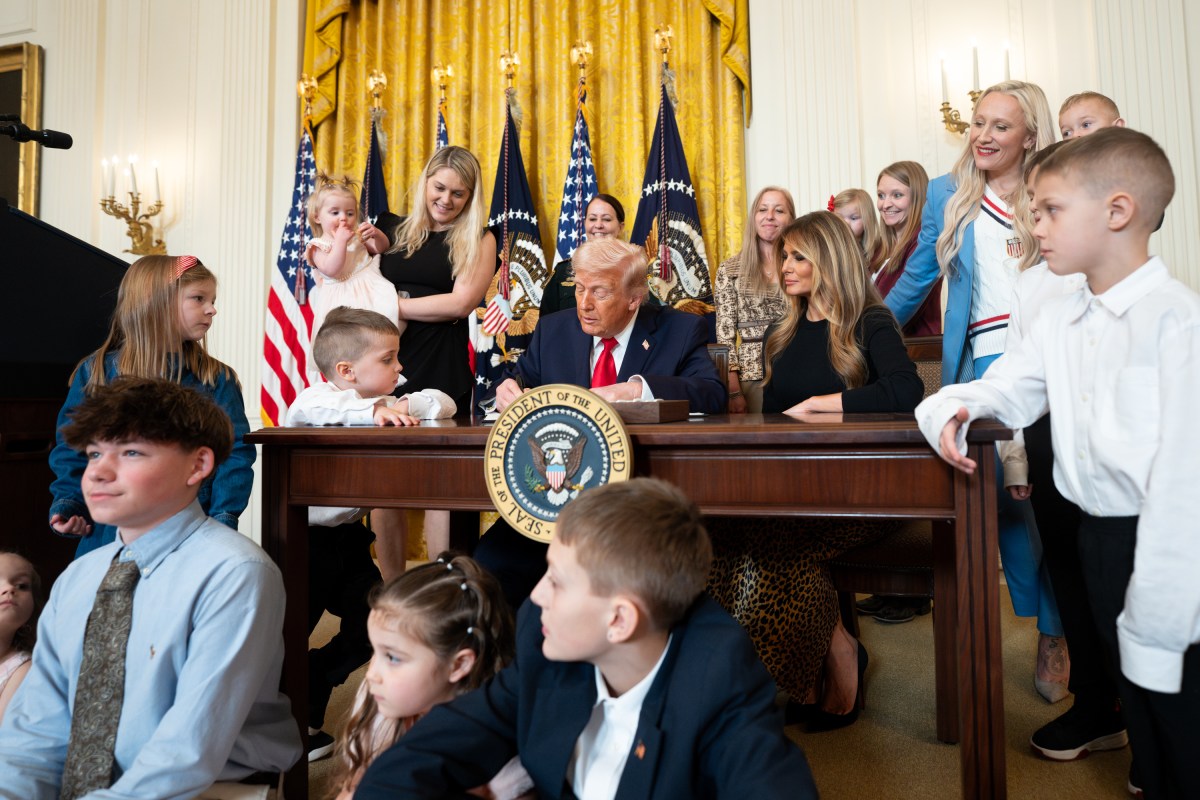 President Donald J. Trump, joined by First Lady Melania Trump, signs a proclamation at an event celebrating Women’s History Month and National Working Mom’s Day, Thursday, March 12, 2026, in the East Room of the White House. (Official White House Photo by Andrea Hanks)