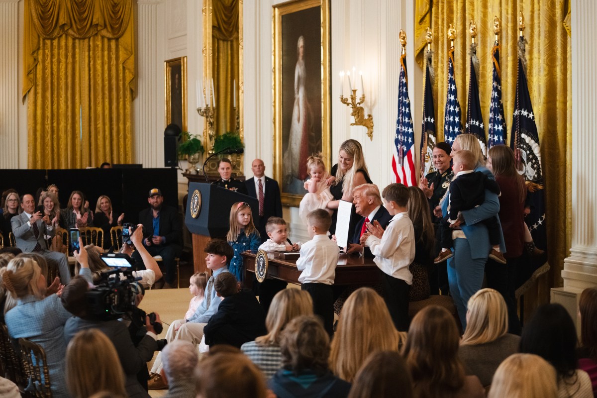President Donald J. Trump, joined by First Lady Melania Trump, signs a proclamation at an event celebrating Women’s History Month and National Working Mom’s Day, Thursday, March 12, 2026, in the East Room of the White House. (Official White House Photo by Cody Hendrix)