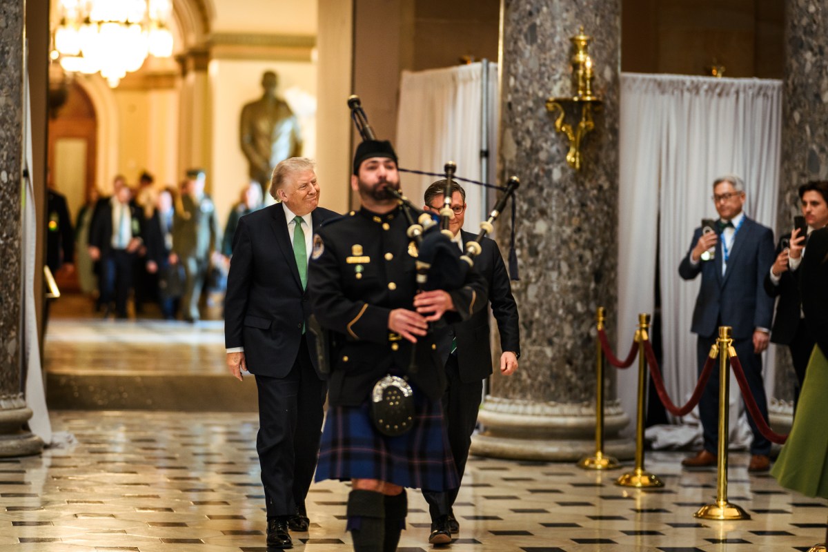 President Donald J. Trump, Taoiseach of Ireland Micheál Martin and House Speaker Mike Johnson (R-LA) are escorted by a bagpiper and Capitol Police Honor Guard after the Friends of Ireland Luncheon at the U.S. Capitol in Washington, D.C. on Tuesday, March 17, 2026. (Official White House Photo by Daniel Torok)