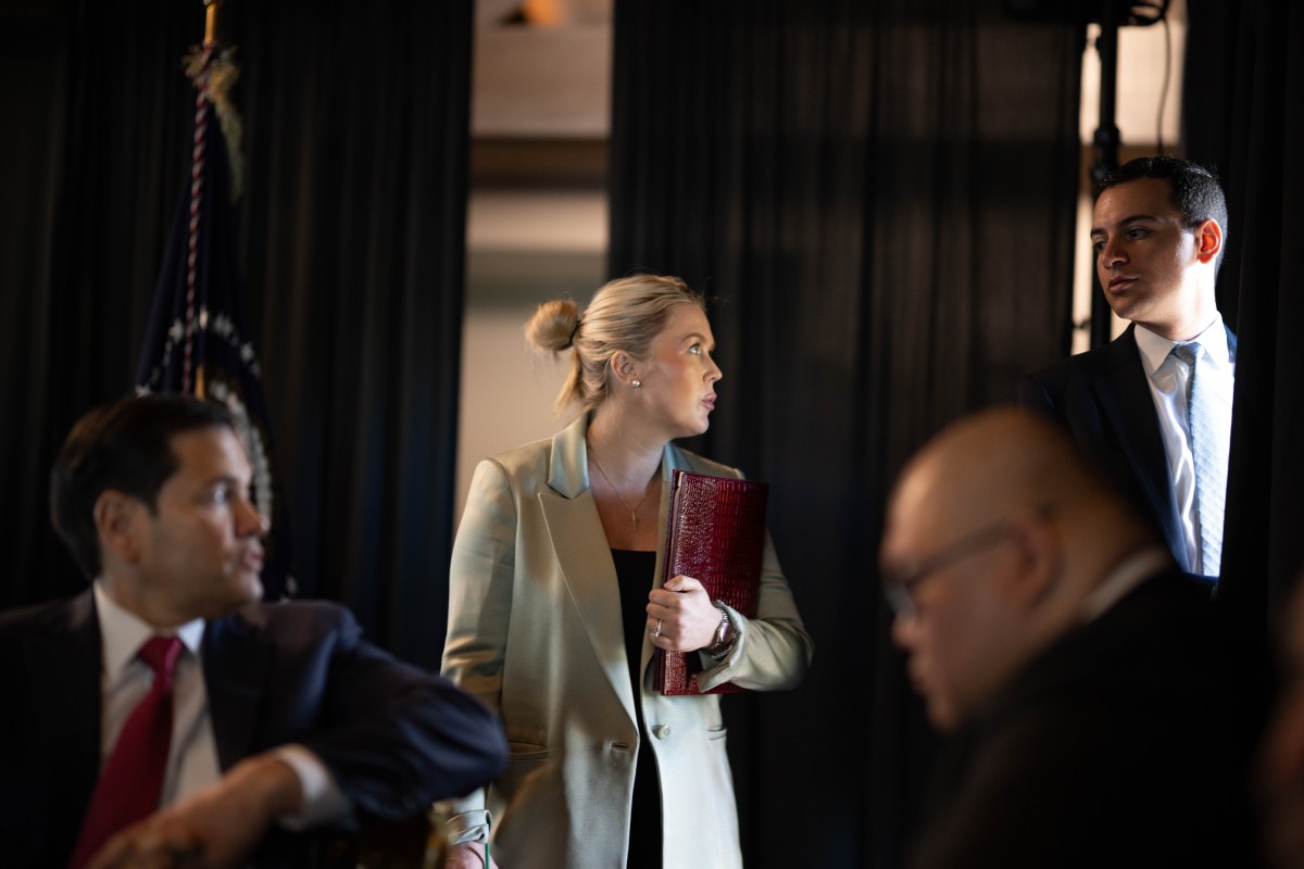 Karoline Leavitt listens as President Donald J. Trump oversees Operation Epic Fury at Mar-a-Lago, Palm Beach, FL, March 1, 2026. (White House photo by Daniel Torok)