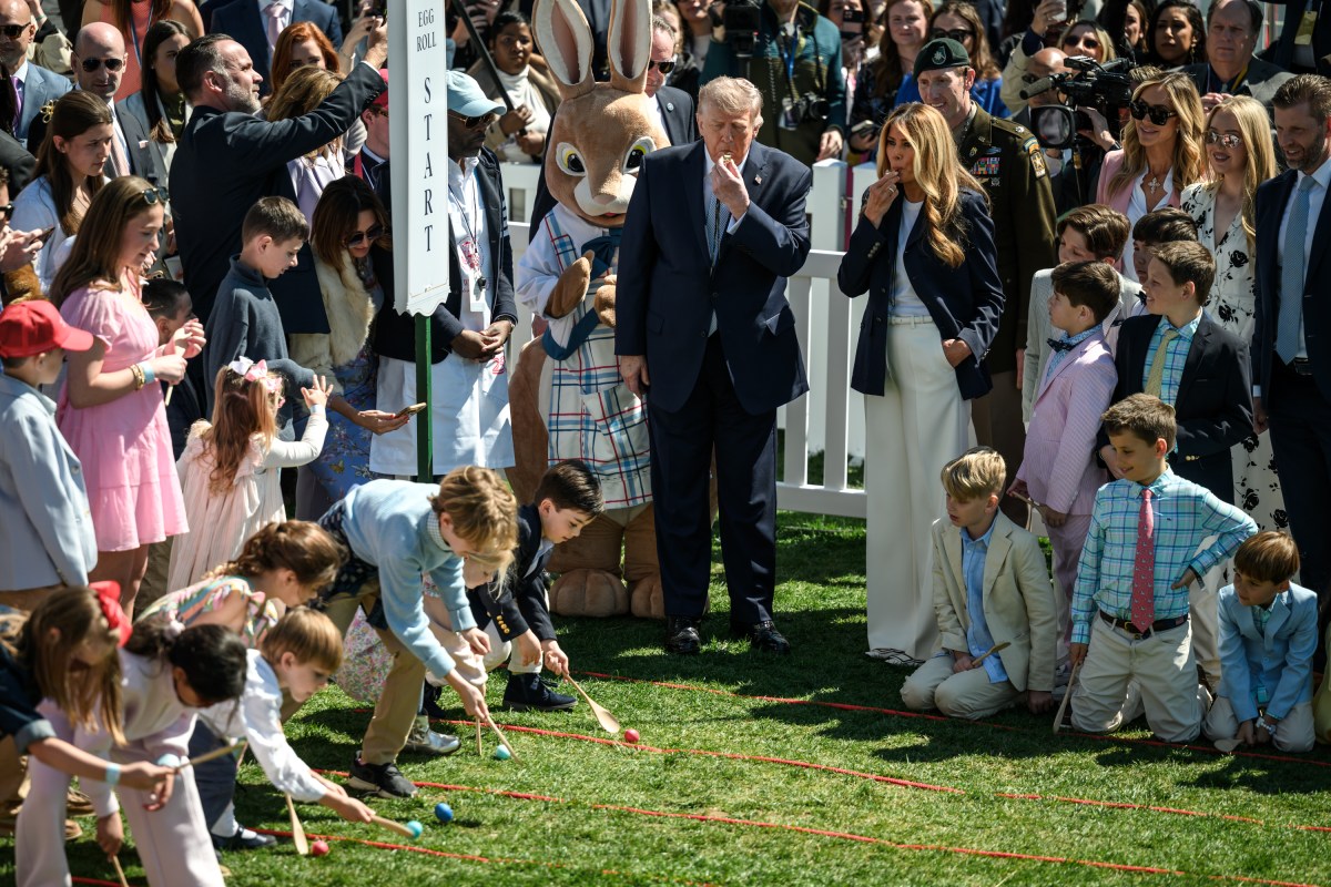 President Donald J. Trump and First Lady Melania Trump are accompanied by the Easter Bunny as they wave to the crowd from the Blue Room Balcony, Monday, April 6, 2026, during the annual White House Easter Egg Roll on the South Lawn. (Official White House Photo by Molly Riley)