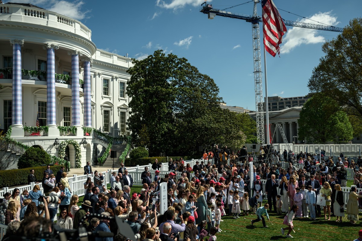 President Donald J. Trump and First Lady Melania Trump are accompanied by the Easter Bunny as they wave to the crowd from the Blue Room Balcony, Monday, April 6, 2026, during the annual White House Easter Egg Roll on the South Lawn. (Official White House Photo by Molly Riley)