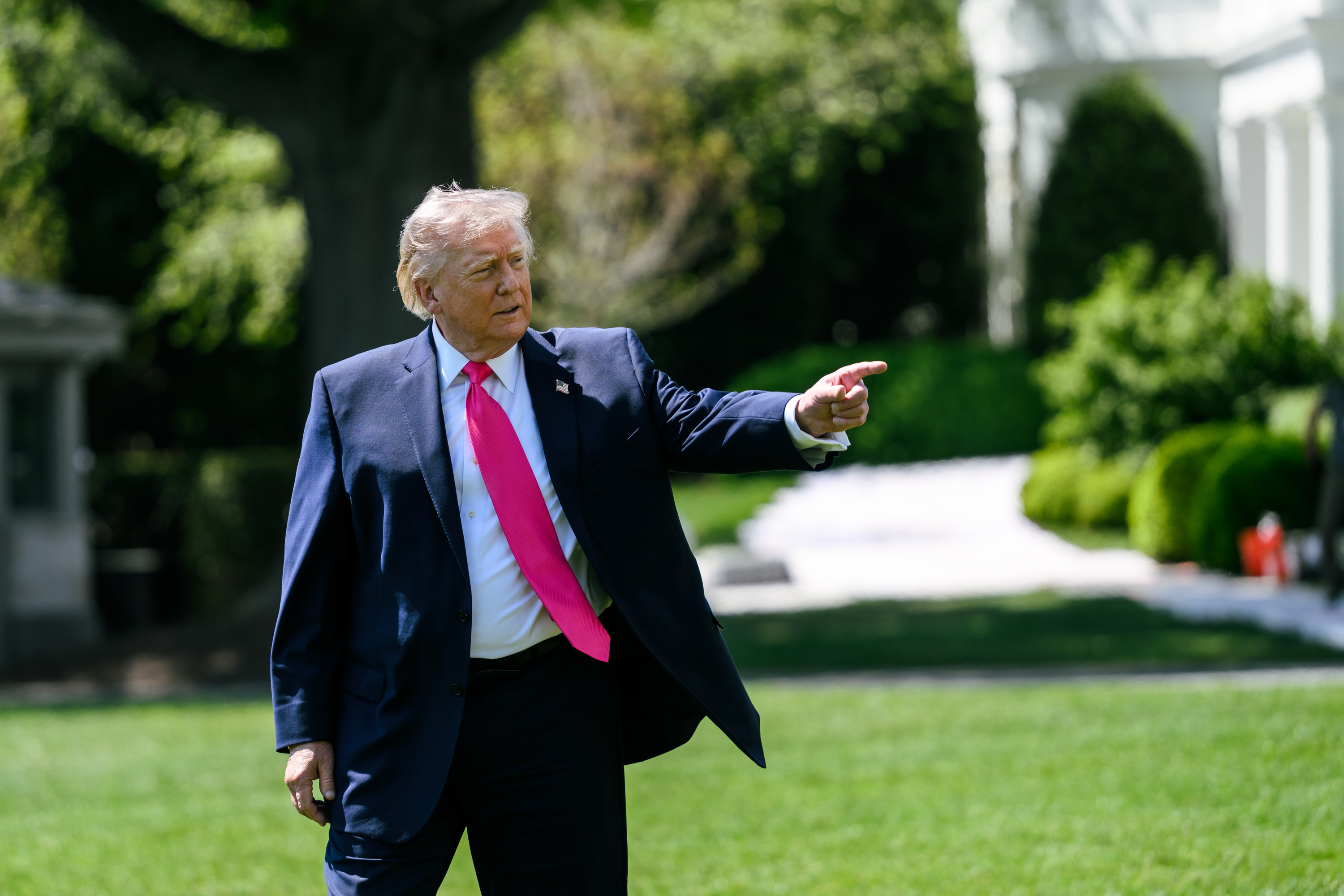 President Donald J. Trump speaks with members of the media before