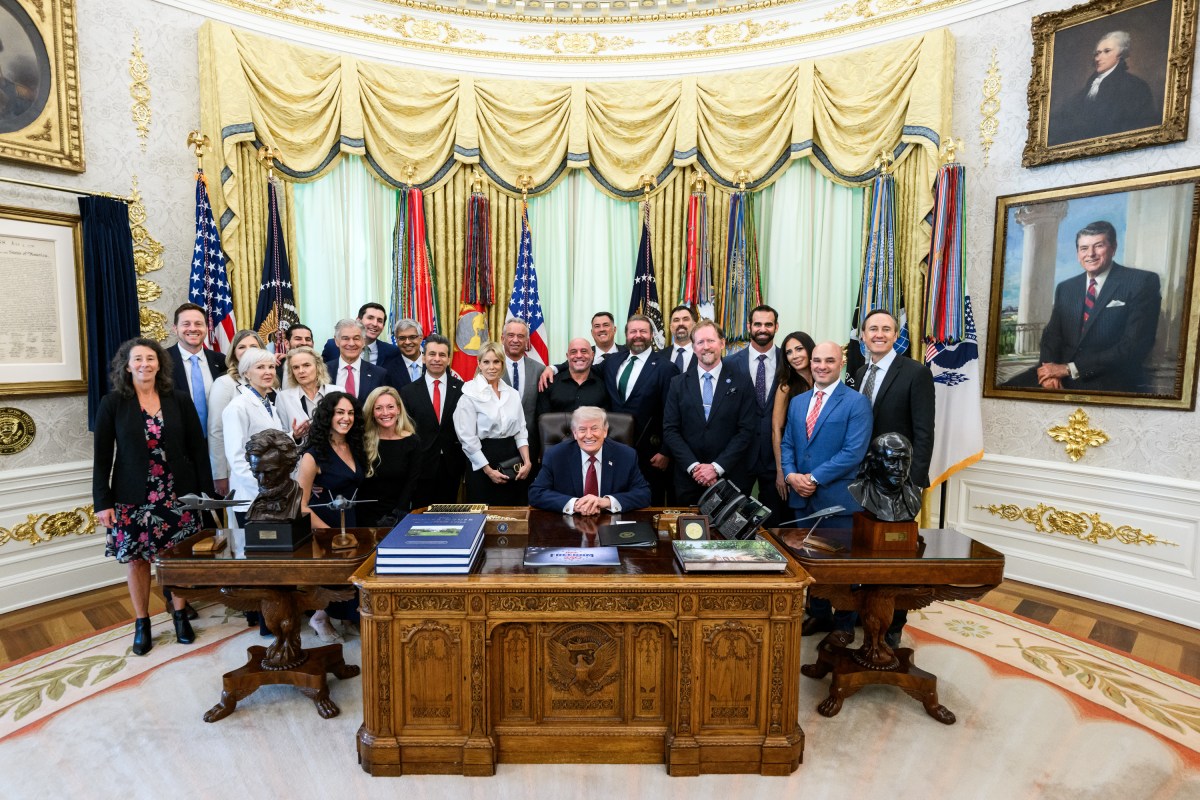 President Donald J. Trump speaks with guests after signing an Executive Order accelerating medical treatments for serious mental illness, Saturday, April 18, 2026, in the Oval Office. (Official White House Photo by Daniel Torok)