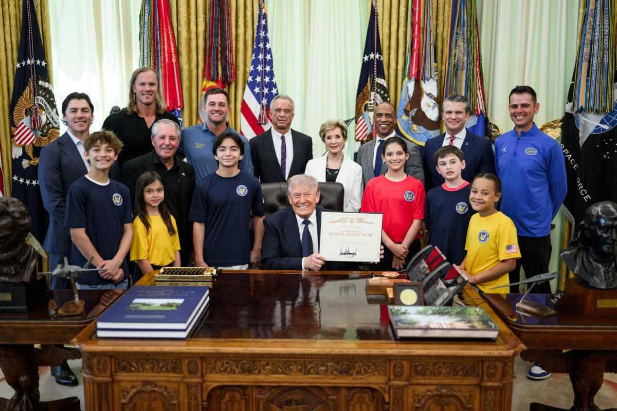 President Donald Trump signs a National Physical Fitness proclamation and revitalized Presidential Physical Fitness Test Award in the Oval Office, Tuesday, May 5, 2026. (Official White House Photo by Daniel Torok)