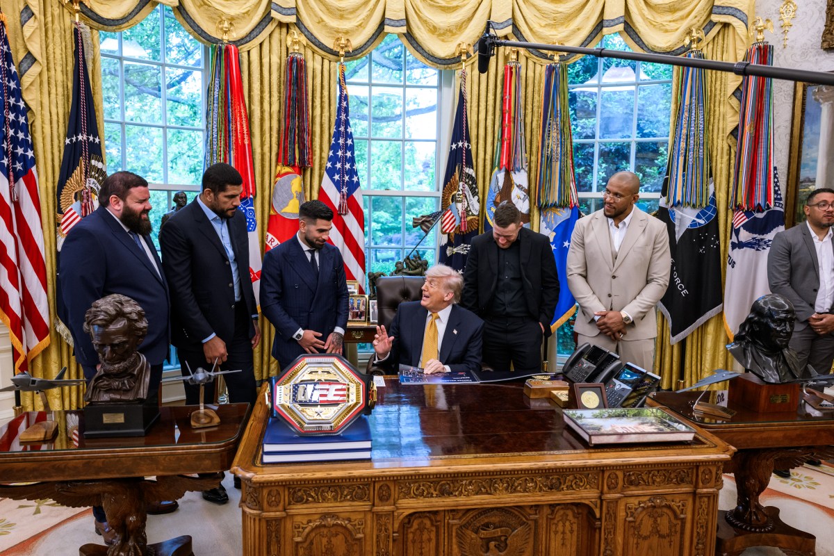 President Donald J. Trump speaks with members of the media alongside UFC fighters in the Oval Office, Wednesday, May 6, 2026. (Official White House Photo by Molly Riley)