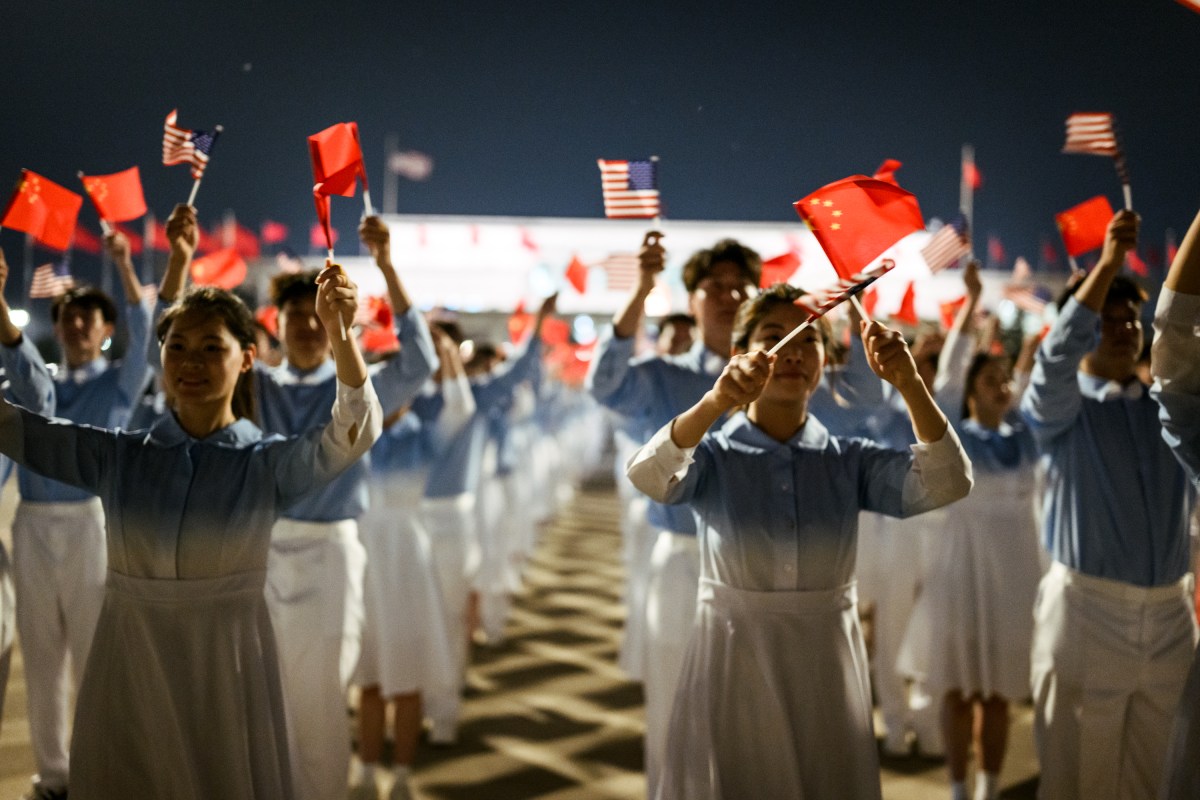 Chinese children wave U.S. and Chinese flags during President Donald J. Trump’s arrival at Beijing International Airport, Wednesday, May 13, 2026. (Official White House Photo by Daniel Torok)