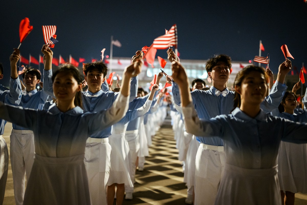 Chinese children wave U.S. and Chinese flags during President Donald J. Trump’s arrival at Beijing International Airport, Wednesday, May 13, 2026. (Official White House Photo by Daniel Torok)