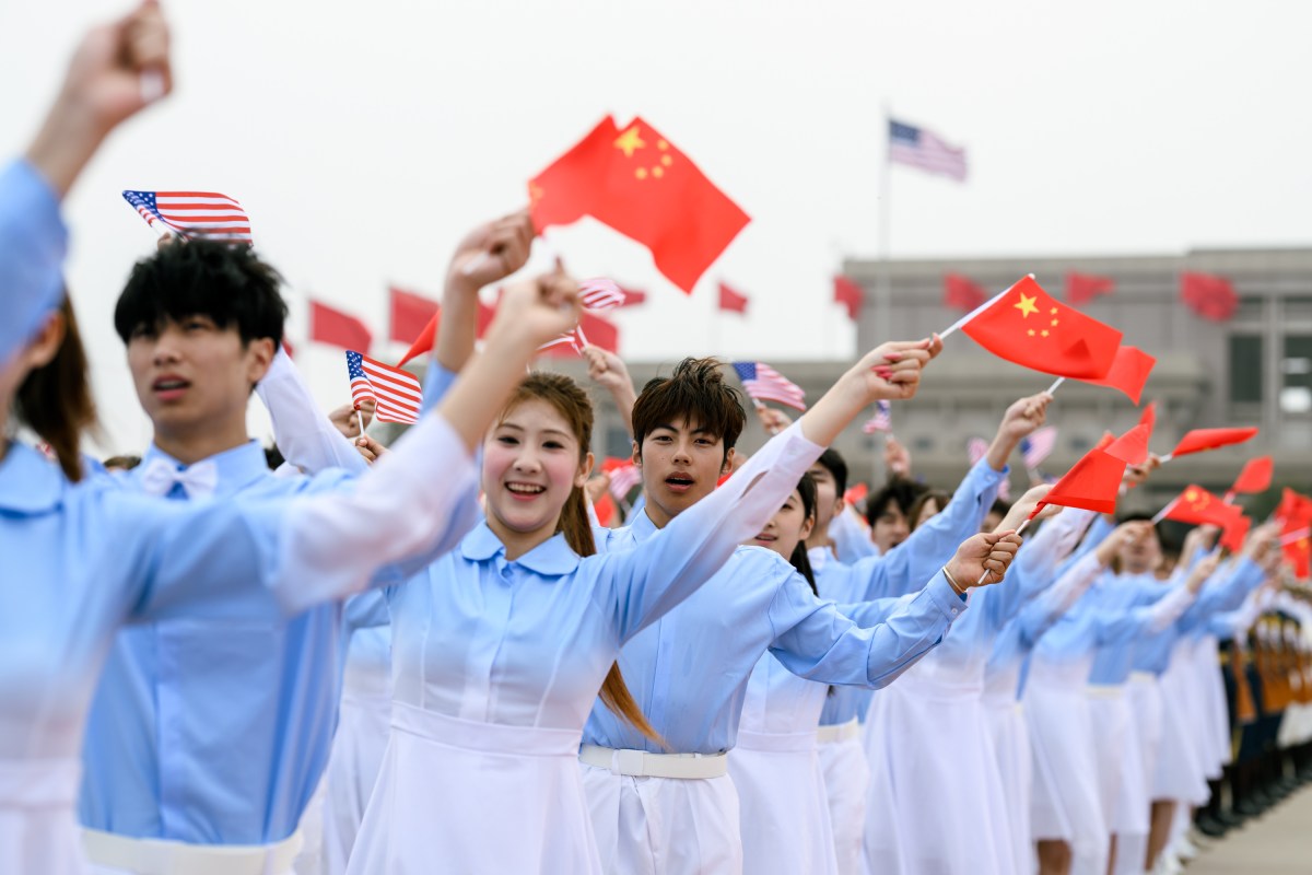 Chinese performers cheer as President Donald J. Trump boards Air Force One at Beijing Capital International Airport, China on Friday, May 15, 2025, en route Washington, D.C. (Official White House Photo by Daniel Torok)