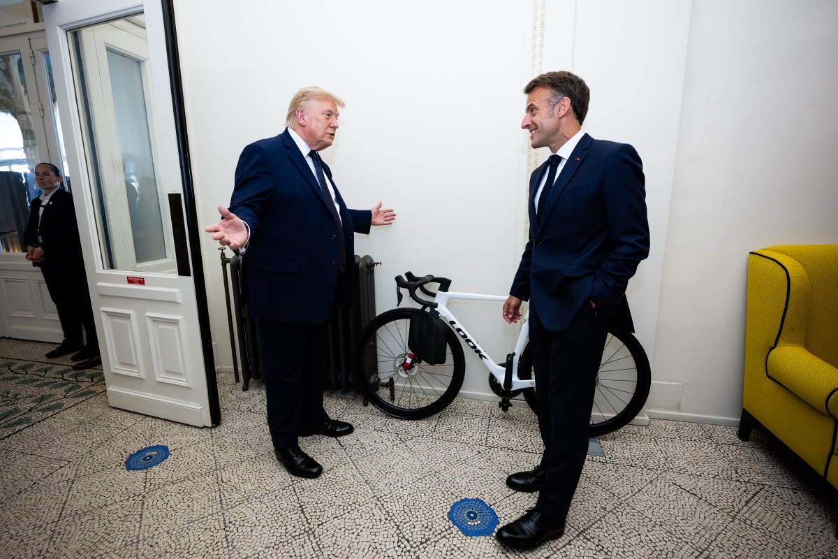 President Donald J. Trump is presented with a bicycle, as a gift from President Emmanuel Macron of France at the Hotel Royal Evian, Monday, June 15, 2026, during the G7 in Evians-les-Bains, France. (Official White House Photo by Daniel Torok)
