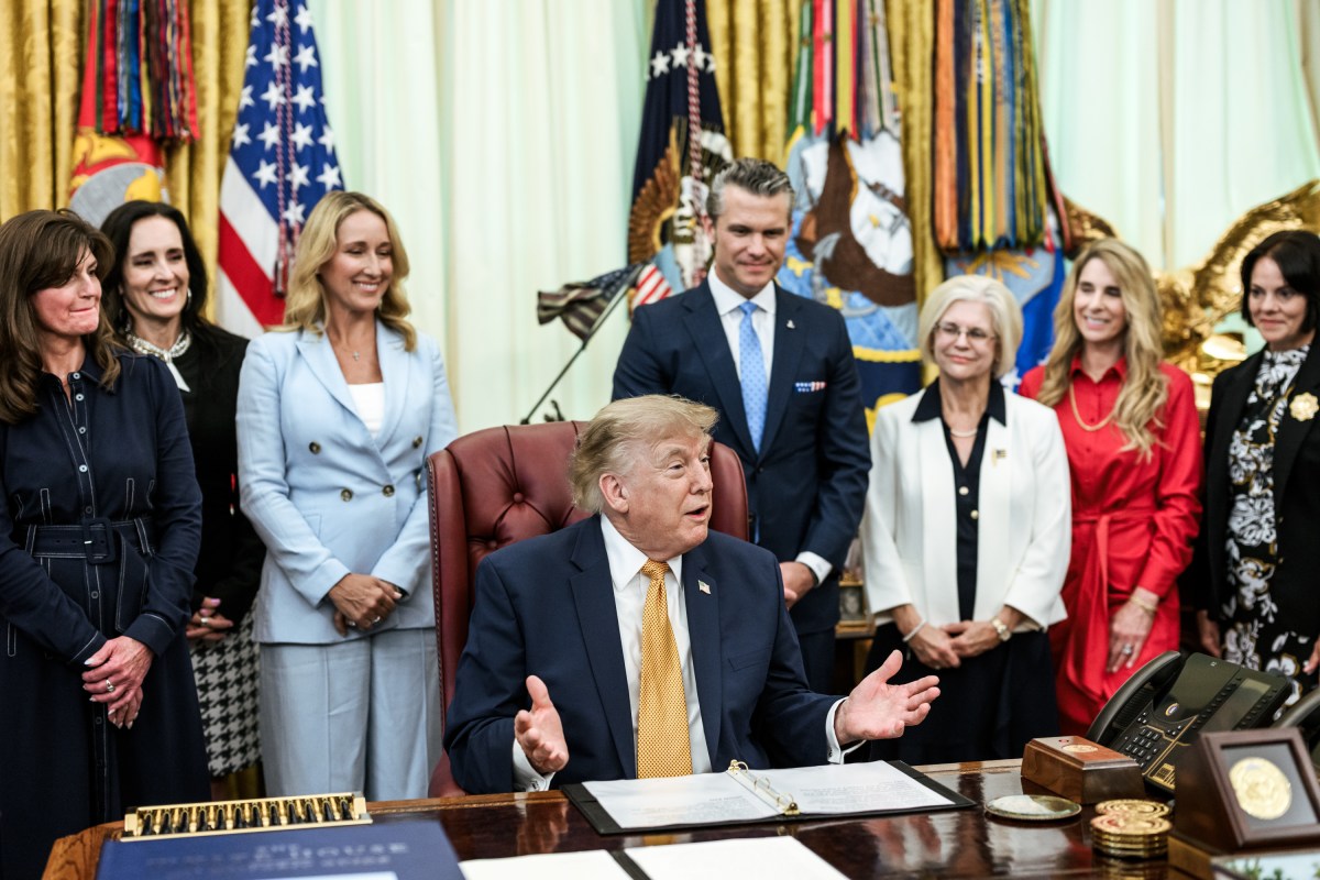 President Donald J. Trump, joined by Secretary of War Pete Hegseth and wife Jennifer Hegseth, signs an executive order creating a new White House commission focused on military families, Monday, August 3, 2026, in the Oval Office. (Official White House Photo by Molly Riley)