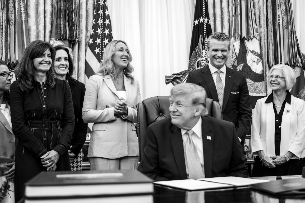 President Donald J. Trump, joined by Secretary of War Pete Hegseth and wife Jennifer Hegseth, signs an executive order creating a new White House commission focused on military families, Monday, August 3, 2026, in the Oval Office. (Official White House Photo by Molly Riley)