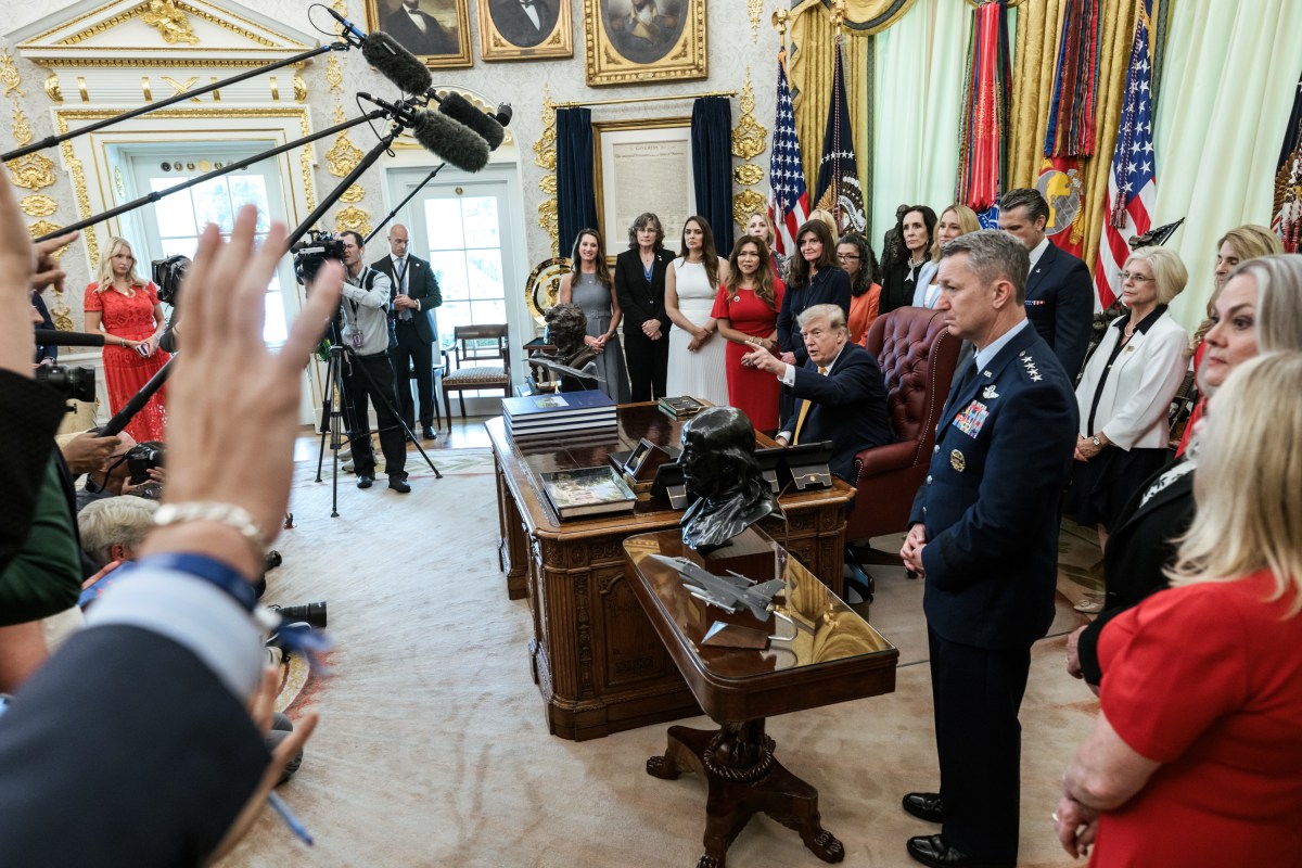President Donald J. Trump, joined by Secretary of War Pete Hegseth and wife Jennifer Hegseth, signs an executive order creating a new White House commission focused on military families, Monday, August 3, 2026, in the Oval Office. (Official White House Photo by Molly Riley)