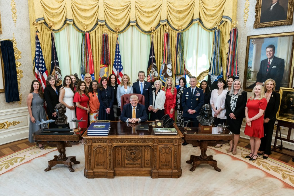 President Donald J. Trump, joined by Secretary of War Pete Hegseth and wife Jennifer Hegseth, signs an executive order creating a new White House commission focused on military families, Monday, August 3, 2026, in the Oval Office. (Official White House Photo by Molly Riley)