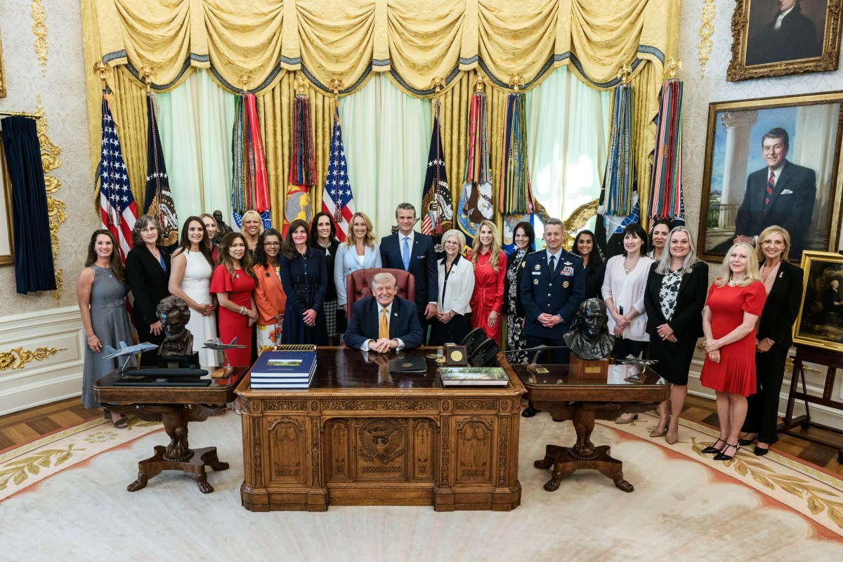 President Donald J. Trump, joined by Secretary of War Pete Hegseth and wife Jennifer Hegseth, signs an executive order creating a new White House commission focused on military families, Monday, August 3, 2026, in the Oval Office. (Official White House Photo by Molly Riley)