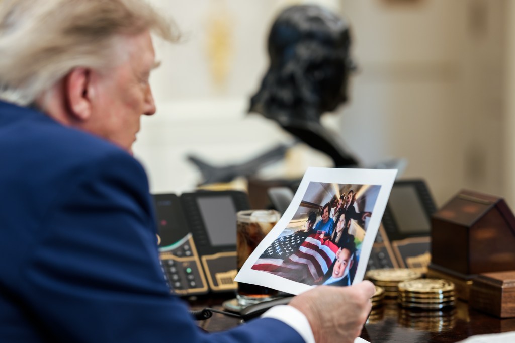 President Donald J. Trump speaks on the phone with freed Russian hostage U.S. Marine veteran Robert Gilman, Tuesday, August 11, 2026, in the Oval Office. (Official White House Photo by Joyce N. Boghosian)