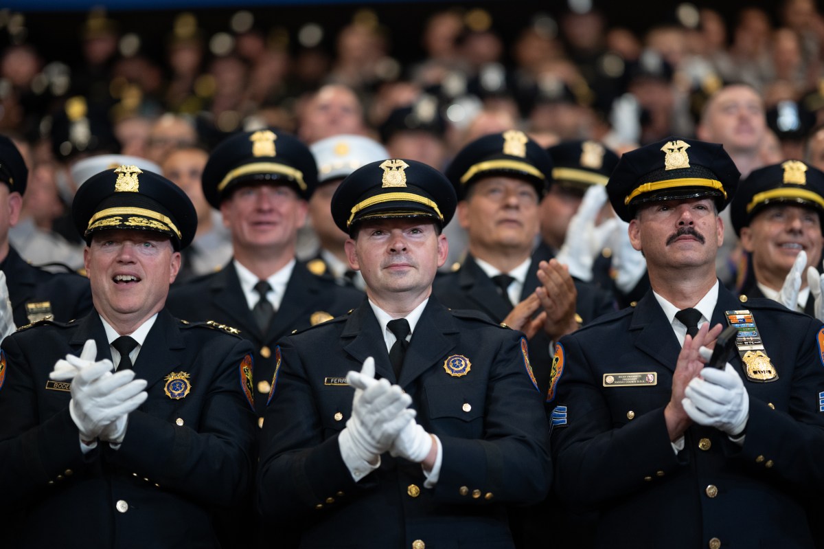 Police officers applaud as President Donald J. Trump delivers remarks at the David S. Mack Center for Training and Intelligence in Garden City, New York, Friday, August 14, 2026. (Official White House Photo by Molly Riley)